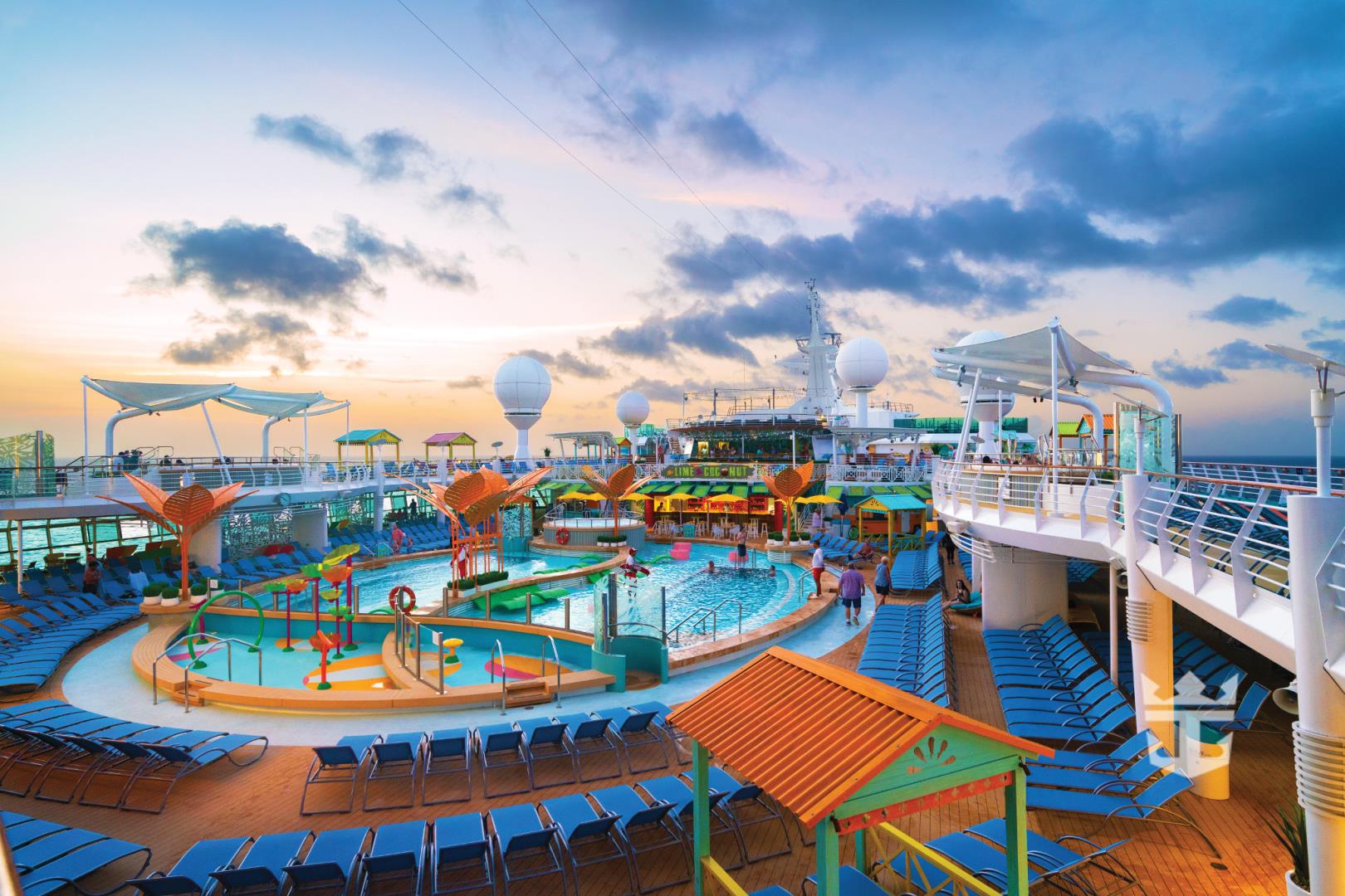 Wide shot of pool deck at sunset